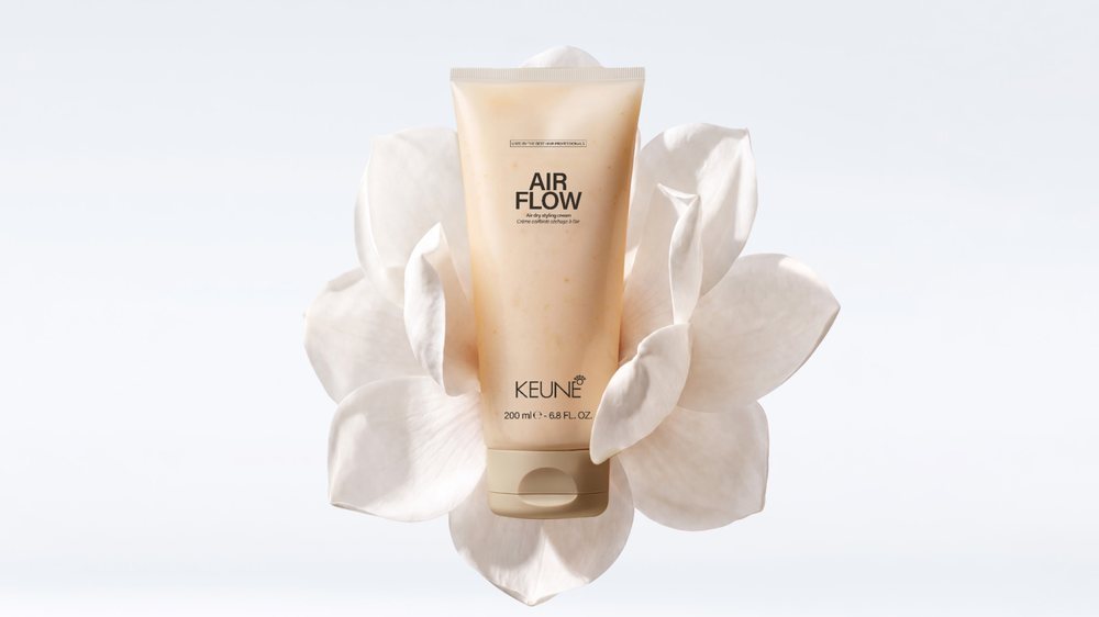 Keune Air Flow among white petals.